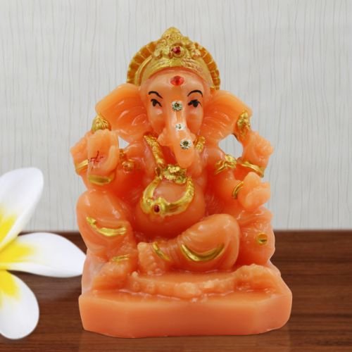 Car Dashboard Idols Small Lord Ganesha Wearing ornaments And Sitting Orange Colour Idol for Home Decor Home Decor Showpiece and Gifts by HomeDecorKart and Karigaari India