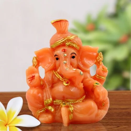 Car Dashboard Idols Lord Ganesha Wearing Paghadi And Sitting With One Leg Fold Orange Colour Idol for Home Decor Home Decor Showpiece and Gifts by HomeDecorKart and Karigaari India