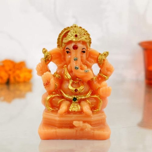 Car Dashboard Idols Lord Ganesha Wearing ornaments And Sitting Orange Colour Idol for Home Decor Home Decor Showpiece and Gifts by HomeDecorKart and Karigaari India