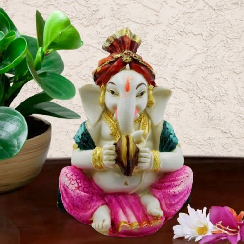 Ganesha Idols Lord Ganesha Playing Instrument wearing Pink Dhoti Idol for Home Decor Home Decor Showpiece and Gifts by HomeDecorKart and Karigaari India