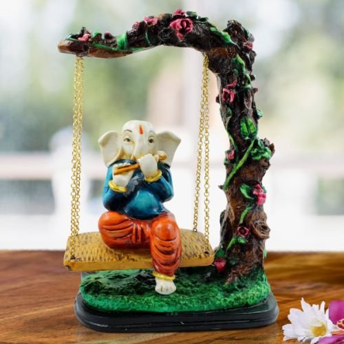 Ganesha Idols Lord Ganesha Sitting on Jhula Playing Flute Idol for Home Decor Home Decor Showpiece and Gifts by HomeDecorKart and Karigaari India