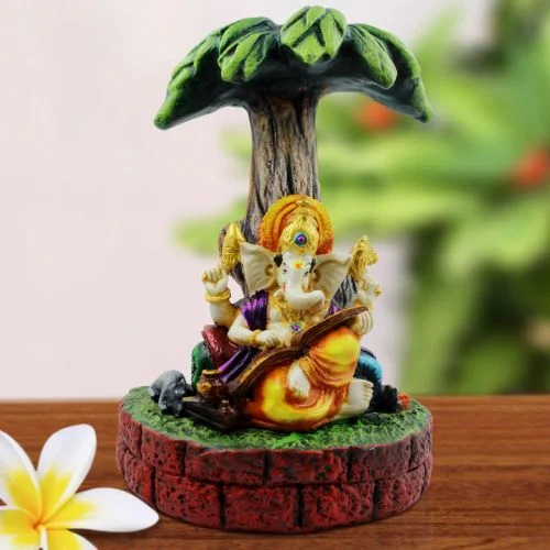Ganesha Idols Lord Ganesha Sitting Under Tree And Playing Guitar Idol for Home Decor Home Decor Showpiece and Gifts by HomeDecorKart and Karigaari India