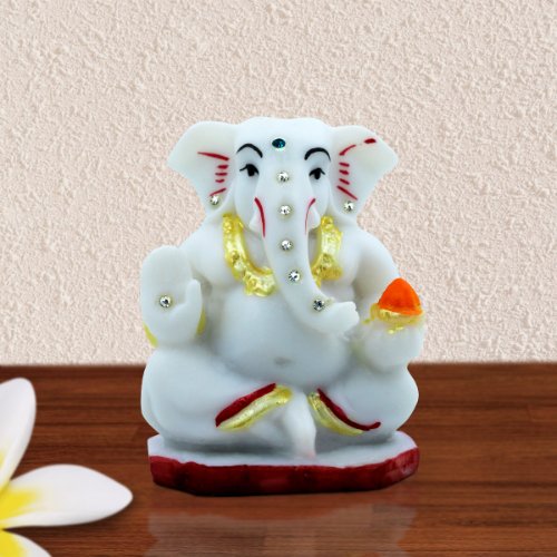 Car Dashboard Idols Small Lord Ganesha Sitting With Holding Red Modak in Hand White Color Idol for Home Decor Home Decor Showpiece and Gifts by HomeDecorKart and Karigaari India