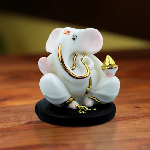 Car Dashboard Idols Small Lord Ganesha Sitting With Holding Golden Modak in Hand White Color Idol for Home Decor Home Decor Showpiece and Gifts by HomeDecorKart and Karigaari India