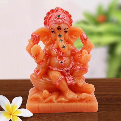 Car Dashboard Idols Small Lord Ganesha Sitting On Rock Idol Orange And Pink Ornaments Best for Home Decor Home Decor Showpiece and Gifts by HomeDecorKart and Karigaari India