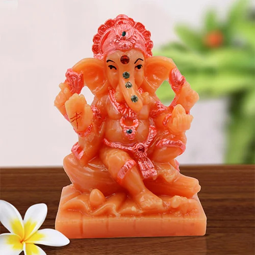 Car Dashboard Idols Small Lord Ganesha Sitting On Rock Idol Orange And Pink Ornaments Best for Home Decor Home Decor Showpiece and Gifts by HomeDecorKart and Karigaari India