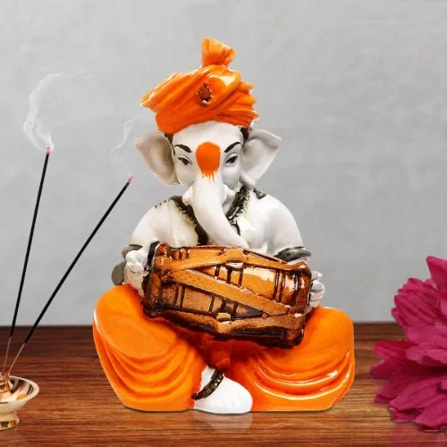 Ganesha Idols Unique Little Lord Ganesha Playing Dhol Idol Orange Best for Home Decor Home Decor Showpiece and Gifts by HomeDecorKart and Karigaari India