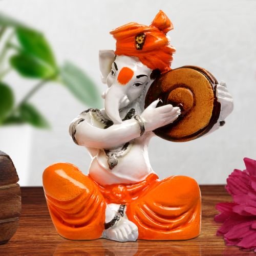 Ganesha Idols Unique Little Lord Ganesha Playing Dafli Idol Orange Best for Home Decor Home Decor Showpiece and Gifts by HomeDecorKart and Karigaari India