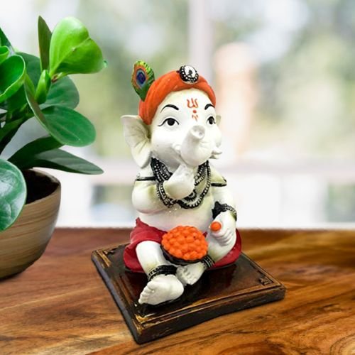 Ganesha Idols Little Lord Ganesha Sitting & Eating Laddu Idol Best for Home Decor Home Decor Showpiece and Gifts by HomeDecorKart and Karigaari India