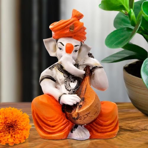 Ganesha Idols Lord Ganesha Idol Sitting & Playing Veena Orange Color Best for Home Decor Home Decor Showpiece and Gifts by HomeDecorKart and Karigaari India