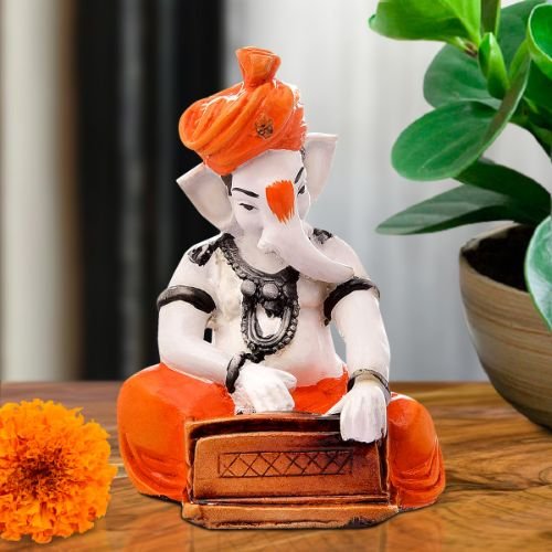 Ganesha Idols Unique Design Lord Ganesha Playing Instruments Idol Orange Best Item for Home Decor Home Decor Showpiece and Gifts by HomeDecorKart and Karigaari India