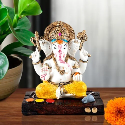 Car Dashboard Idols Lord Ganesha Idol Sitting Wearing Yellow Dhoti Best Item for Home Decor Home Decor Showpiece and Gifts by HomeDecorKart and Karigaari India