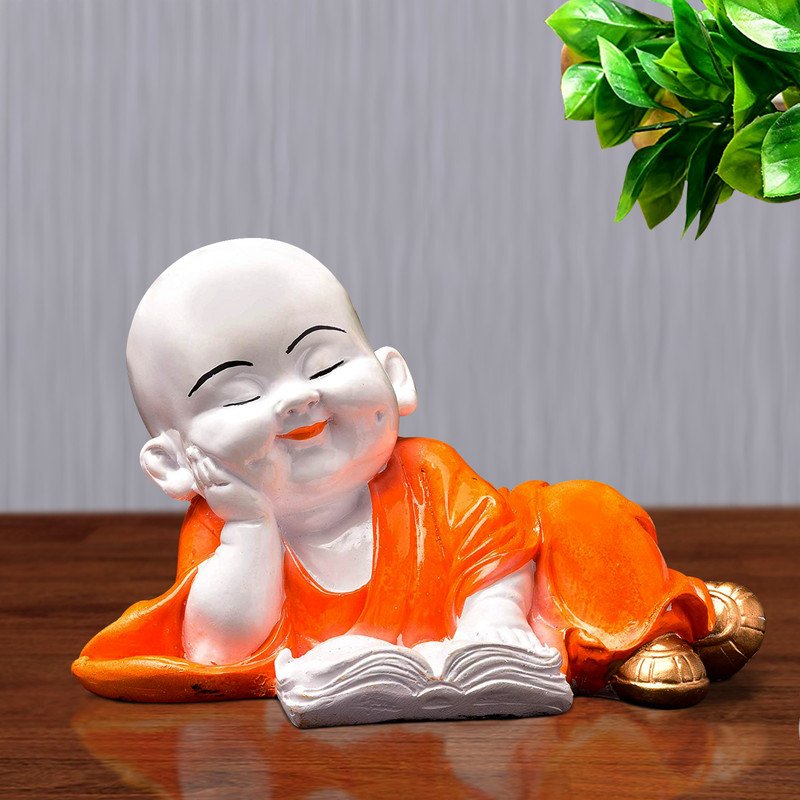 Buddha Idols Handcrafted Ployresin Lord Buddha Multicolour Sleeping And Reading Book Statue Showpiece Home Decor/Office Decor/Spiritual Gift Home Decor Showpiece and Gifts by HomeDecorKart and Karigaari India