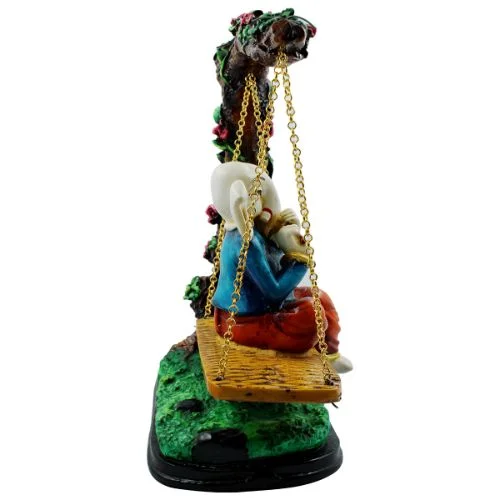Ganesha Idols Lord Ganesha Sitting on Jhula Playing Flute Idol for Home Decor Home Decor Showpiece and Gifts by HomeDecorKart and Karigaari India