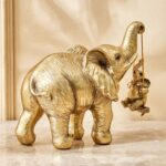 Gold Finish Elephant with Hanging Baby Decorative Resin Animal Idol-Gold Home Accent Showpiece - Karigaari India Aesthetic Home Decor