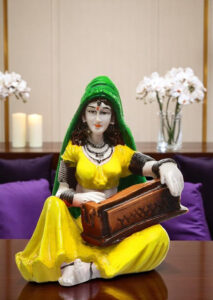 Enchanting Melody Figurine: Hand-Painted Resin Rajasthani Woman with Instrument - Karigaari India Aesthetic Home Decor