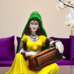 Enchanting Melody Figurine: Hand-Painted Resin Rajasthani Woman with Instrument - Karigaari India Aesthetic Home Decor