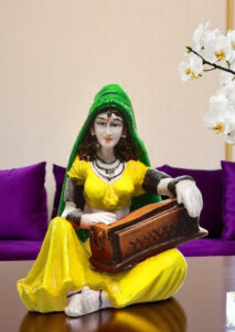 Enchanting Melody Figurine: Hand-Painted Resin Rajasthani Woman with Instrument - Karigaari India Aesthetic Home Decor