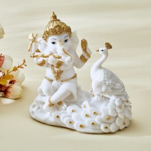 Elegant Ganesh Playing Flute with Peacock Statue White & Gold Resin Idol for Home Decor & Gifting - Karigaari India Aesthetic Home Decor