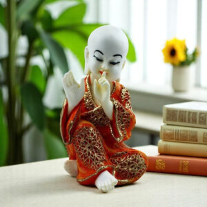Handcrafted Ployresin Lord Buddha Sitting And Putting Finger On Mouth Statue Showpiece Home Decor/Office Decor/Spiritual Gift, White And Orange - Karigaari India Aesthetic Home Decor