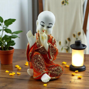 Handcrafted Ployresin Lord Buddha Sitting And Putting Finger On Mouth Statue Showpiece Home Decor/Office Decor/Spiritual Gift, White And Orange - Karigaari India Aesthetic Home Decor