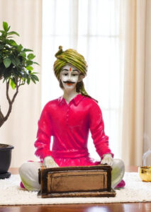 Ancient Notes in Resin: Exquisite Sculpture of a Rajasthani Harmonium Player - Karigaari India Aesthetic Home Decor