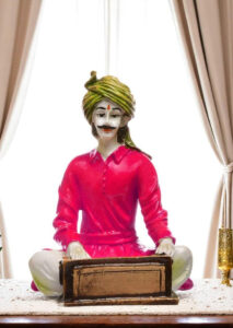 Ancient Notes in Resin: Exquisite Sculpture of a Rajasthani Harmonium Player - Karigaari India Aesthetic Home Decor