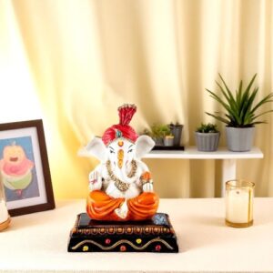 Lord Ganesha Sitting & Giving Blessing With Modak In Hand Best & Unique Design Orange Color for Home Decor - Karigaari India Aesthetic Home Decor