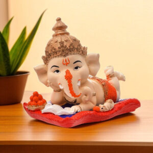 Resin Ganesha Lounging on Cushion - Symbol of Comfort & Blessings - Karigaari India Aesthetic Home Decor