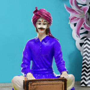 The Soulful Strains of Rajasthan: Hand-Painted Resin Man and His Harmonium - Karigaari India Aesthetic Home Decor