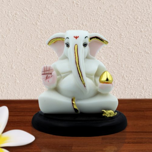 Lord Ganesha Sitting With Holding Modak in Hand White Color Idol for Home Decor - Karigaari India Aesthetic Home Decor
