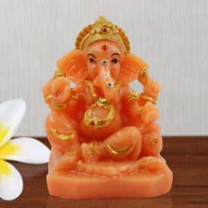 Small Lord Ganesha Wearing ornaments And Sitting Orange Colour Idol for Home Decor - Karigaari India Aesthetic Home Decor