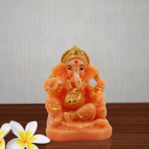Small Lord Ganesha Wearing ornaments And Sitting Orange Colour Idol for Home Decor - Karigaari India Aesthetic Home Decor