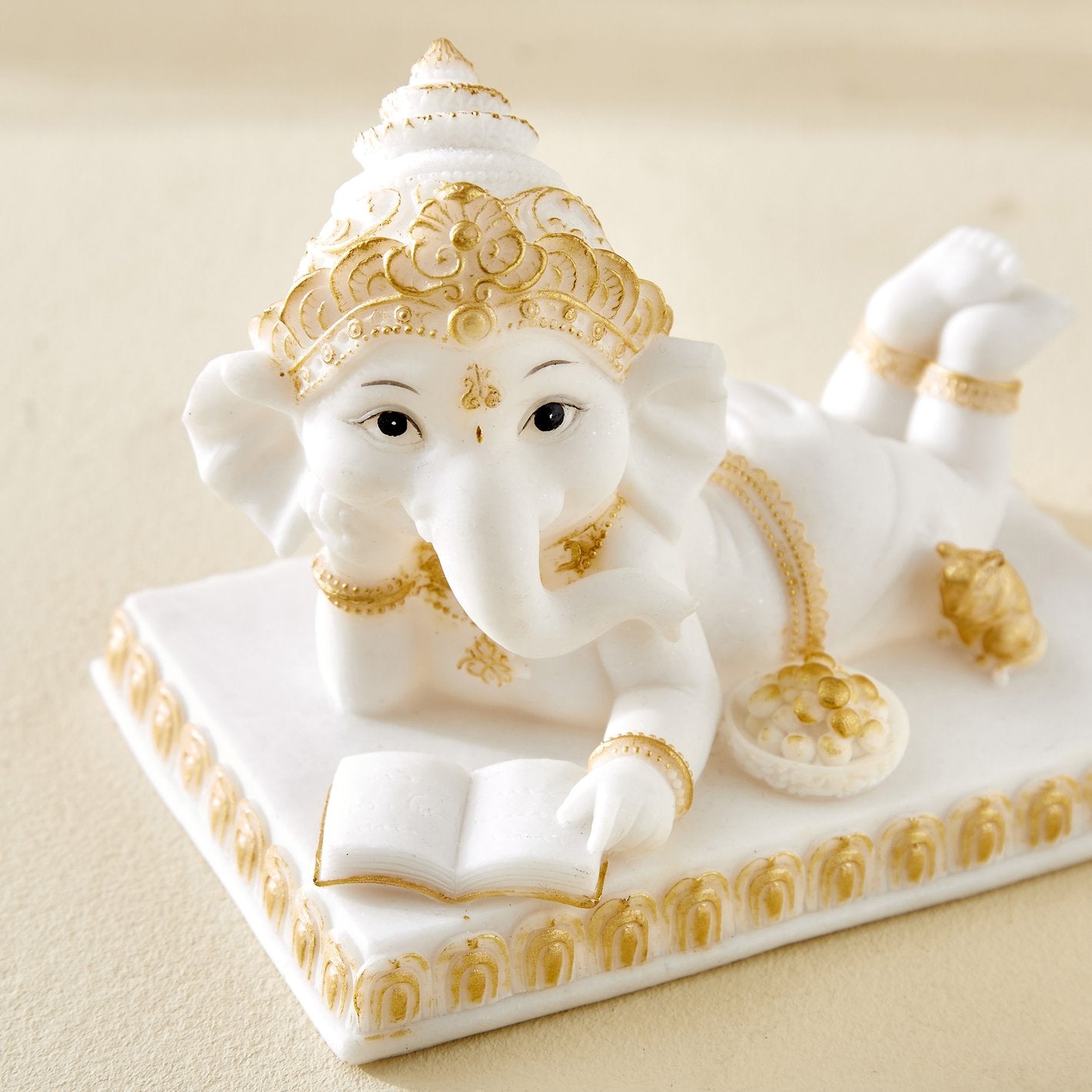 Premium Reading Ganpati Figurine White Gold Resin Crafted Ganesha Figurine For Home Decor Gifting Stylish Accent 3 Reading Ganpati Idol White & Gold Resin Ganesha Statue for Home Decor & Gifting - Karigaari India Aesthetic Home Decor