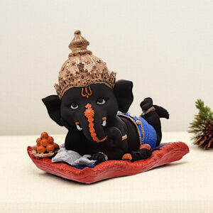 Peaceful Repose Ganesha: Intricately Crafted Resin Reclining Idol with Offerings - Spiritual & Serene - Karigaari India Aesthetic Home Decor