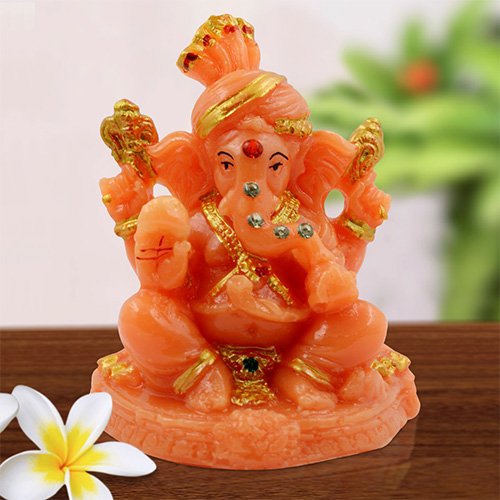 Timeless Distinctive Little Lord Ganesha Sitting With One Leg Up Statue Orange Color And Golden Ornaments Best For Home Decoration Unique Decor Piece 1 Unique Little Lord Ganesha Sitting With One Leg Up Idol Orange Color And Golden Ornaments Best for Home Decor - Karigaari India Aesthetic Home Decor