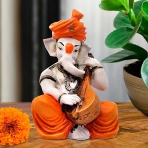 Lord Ganesha Idol Sitting & Playing Veena Orange Color Best for Home Decor - Karigaari India Aesthetic Home Decor
