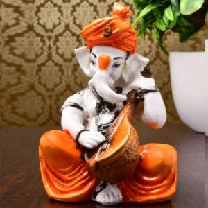 Lord Ganesha Idol Sitting & Playing Veena Orange Color Best for Home Decor - Karigaari India Aesthetic Home Decor