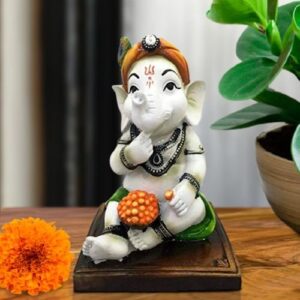 Little Lord Ganesha Sitting & Eating Laddu Idol Multicolor Best for Home Decor - Karigaari India Aesthetic Home Decor
