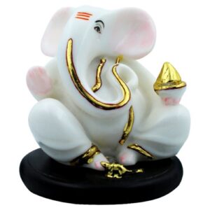 Small Lord Ganesha Sitting With Holding Golden Modak in Hand White Color Idol for Home Decor - Karigaari India Aesthetic Home Decor