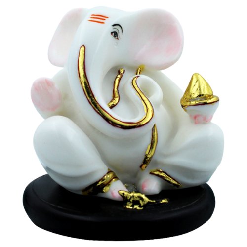 Small Lord Ganesha Sitting With Holding Golden Modak in Hand White Color Idol for Home Decor - Karigaari India Aesthetic Home Decor